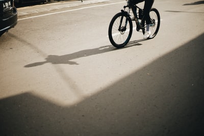 The cyclists on the road during the day
